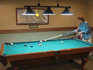 Resident playing billiards