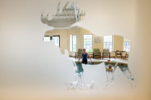 view through frosted glass of trainer at pool