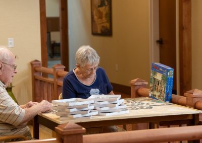 a couple putting a puzzle together